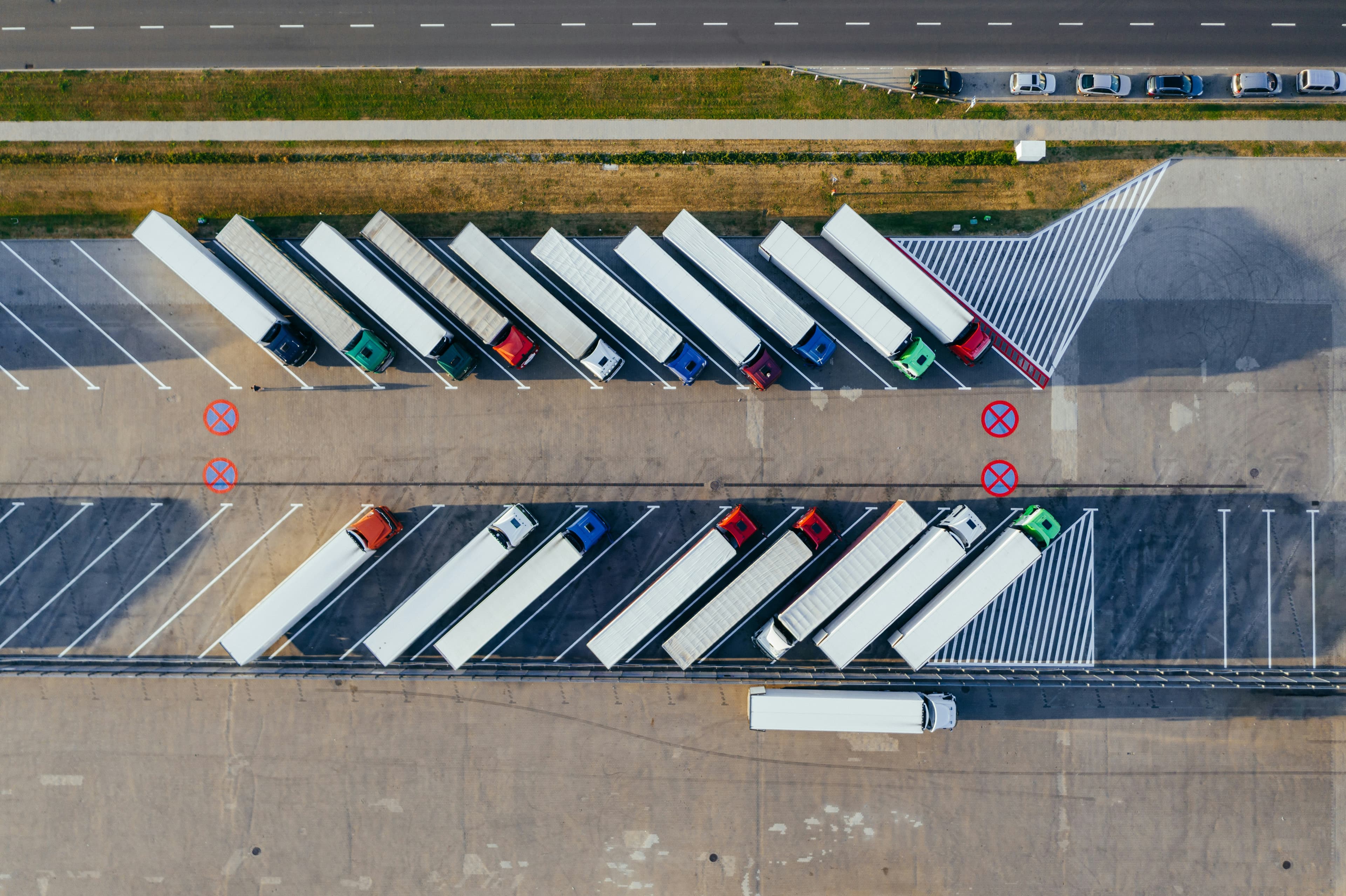 Freight yard with parked trailers and tractors